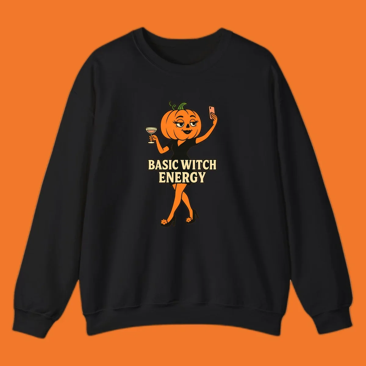Pumpkin character with 'BASIC WITCH ENERGY' text, holding a cocktail and phone for a selfie.