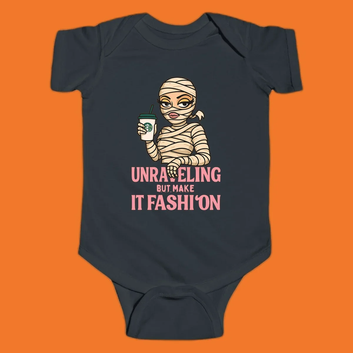 Mummy holding coffee cup with 'Unraveling But Make It Fashion' text. Mummy-fashion-coffee.