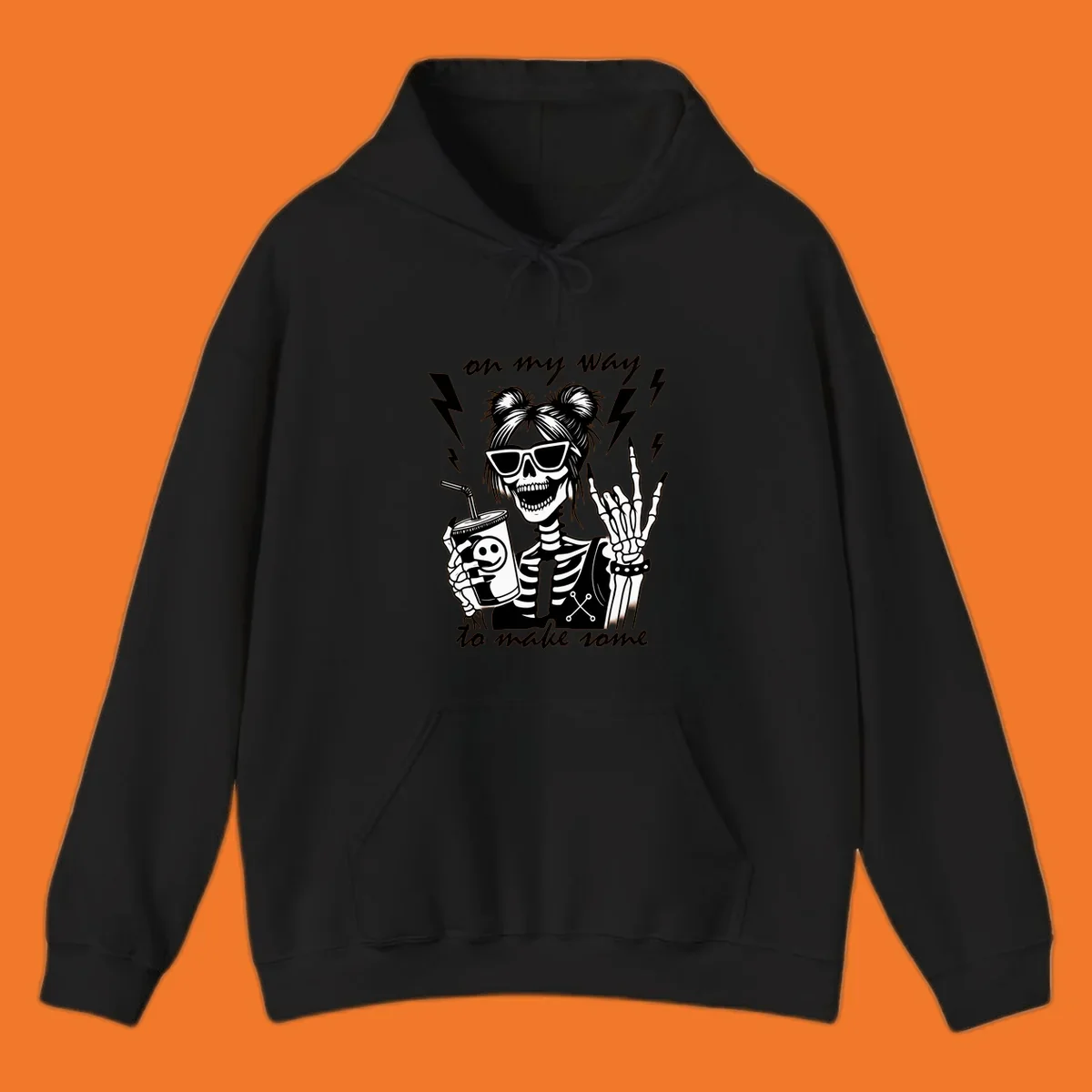 Skeleton with sunglasses and drink making rock-on gesture, text 'on my way to make some', lightning bolts. Skeleton party time.