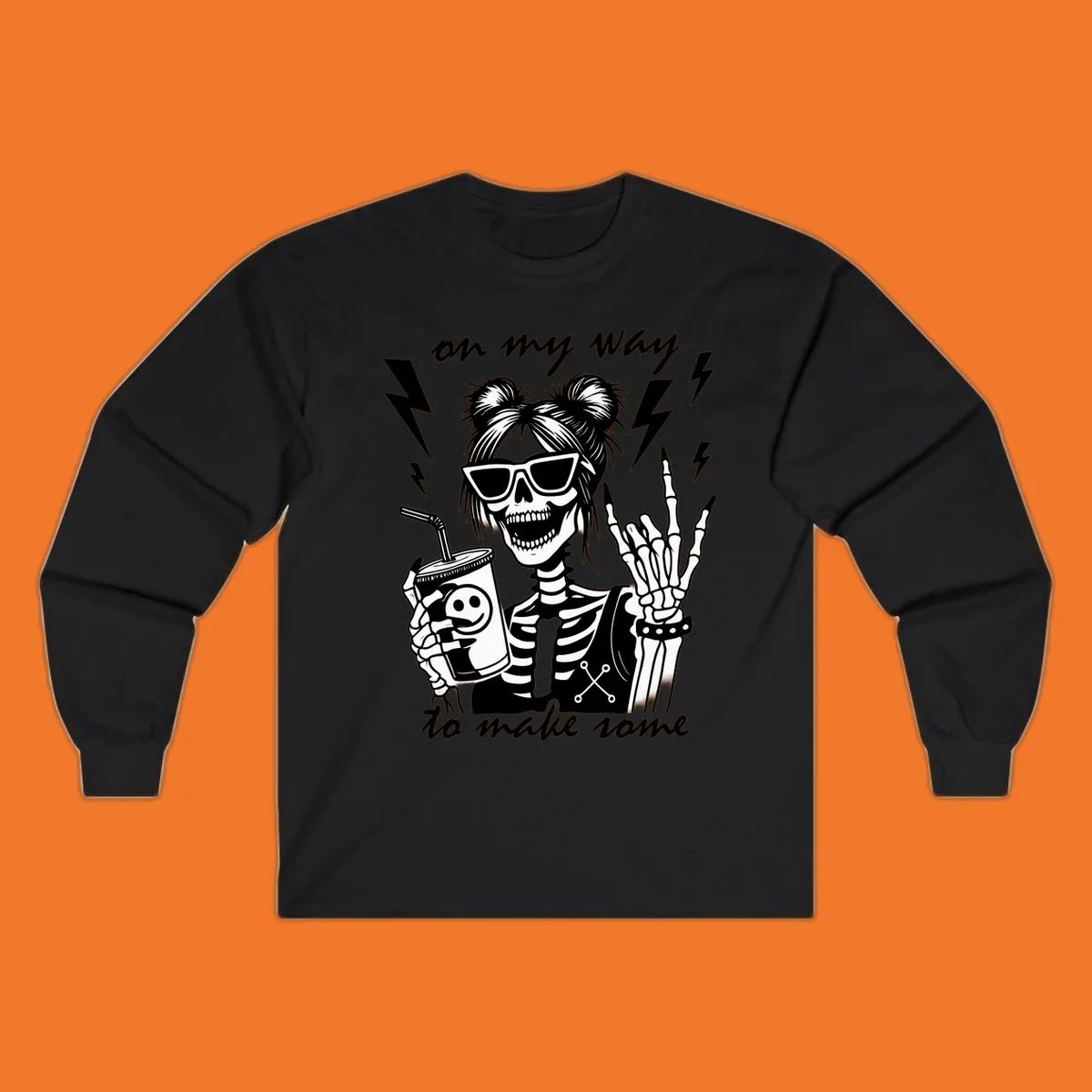 Skeleton with sunglasses and drink making rock-on gesture, text 'on my way to make some', lightning bolts. Skeleton party time.