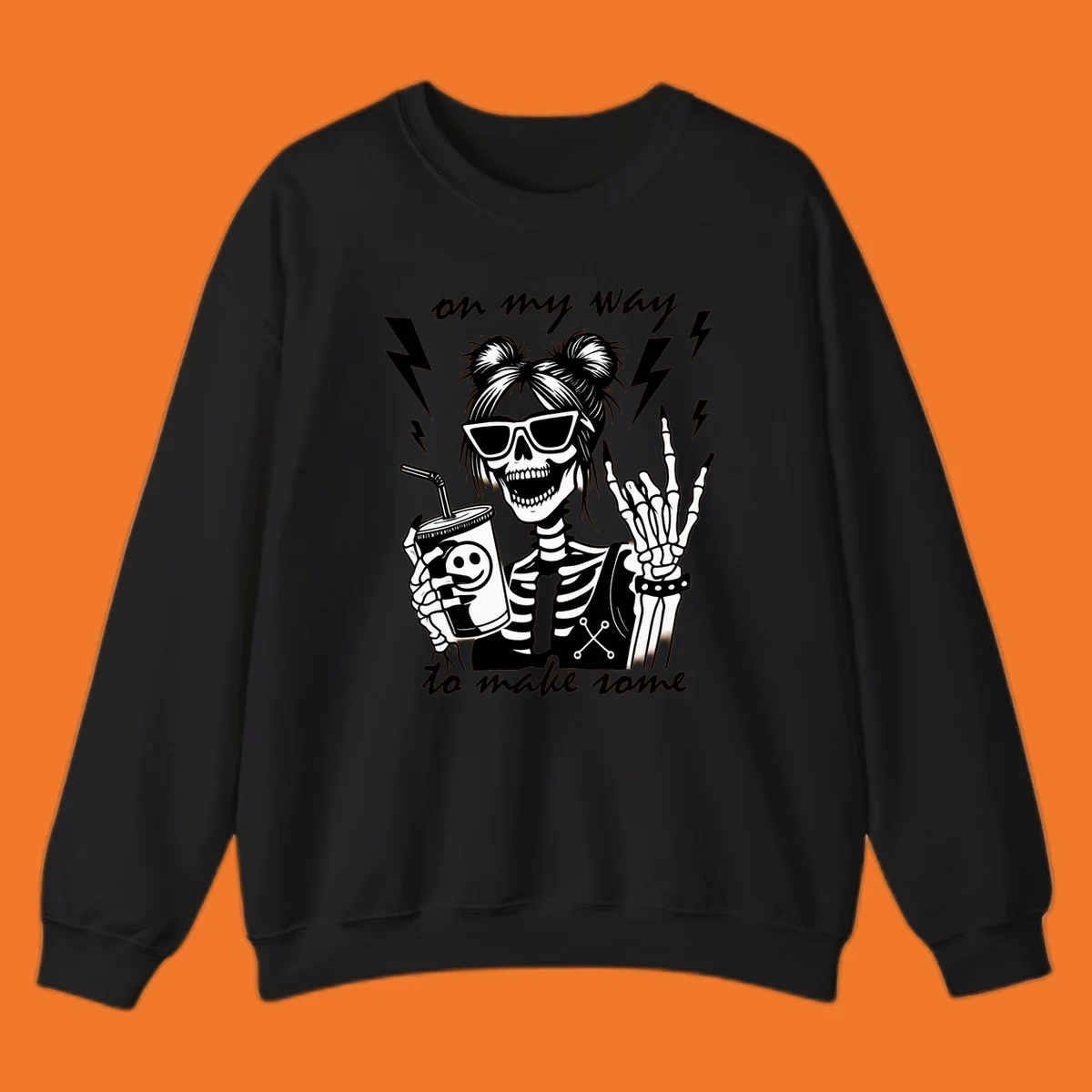 Skeleton with sunglasses and drink making rock-on gesture, text 'on my way to make some', lightning bolts. Skeleton party time.
