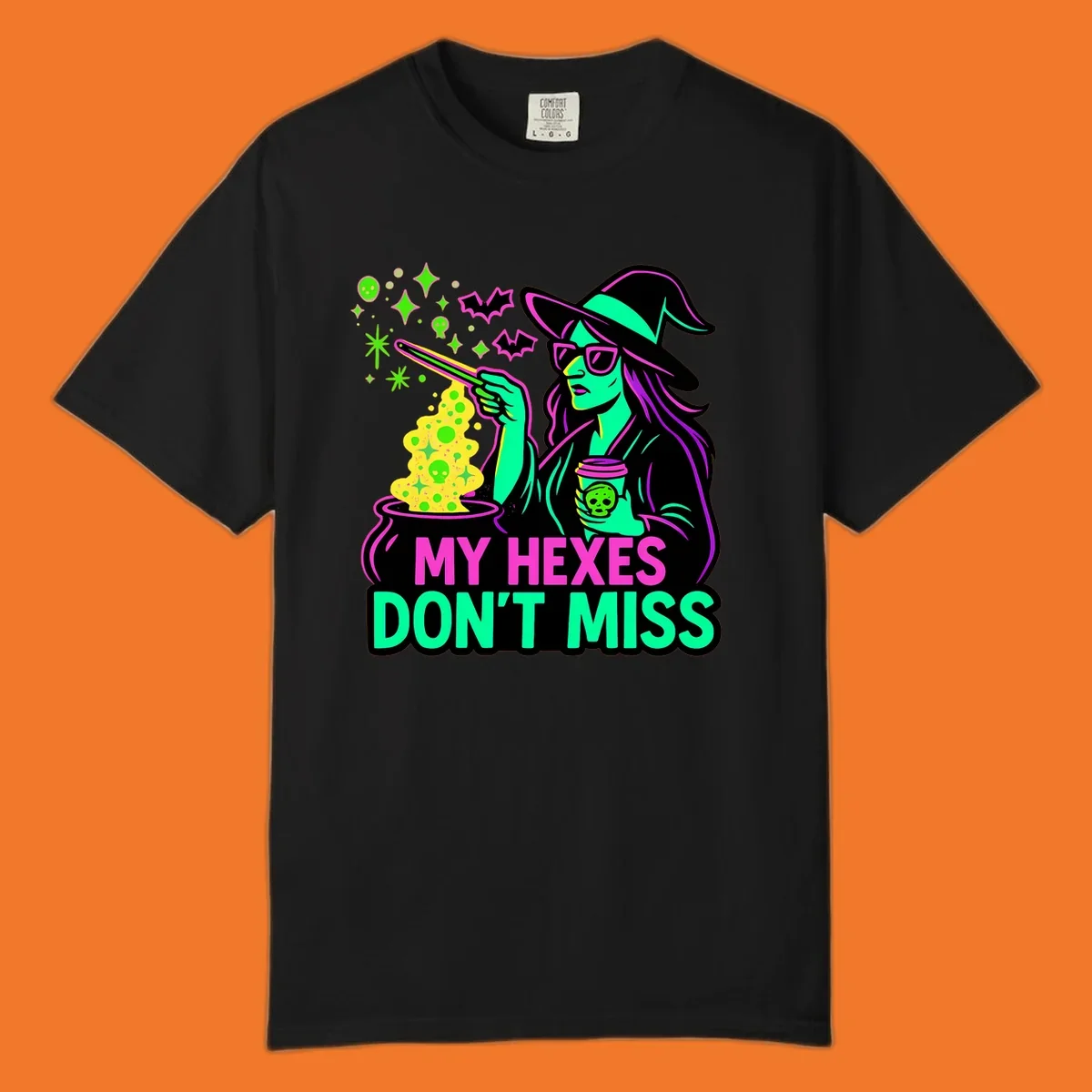 Witch with coffee and cauldron, text 'My Hexes Don't Miss'