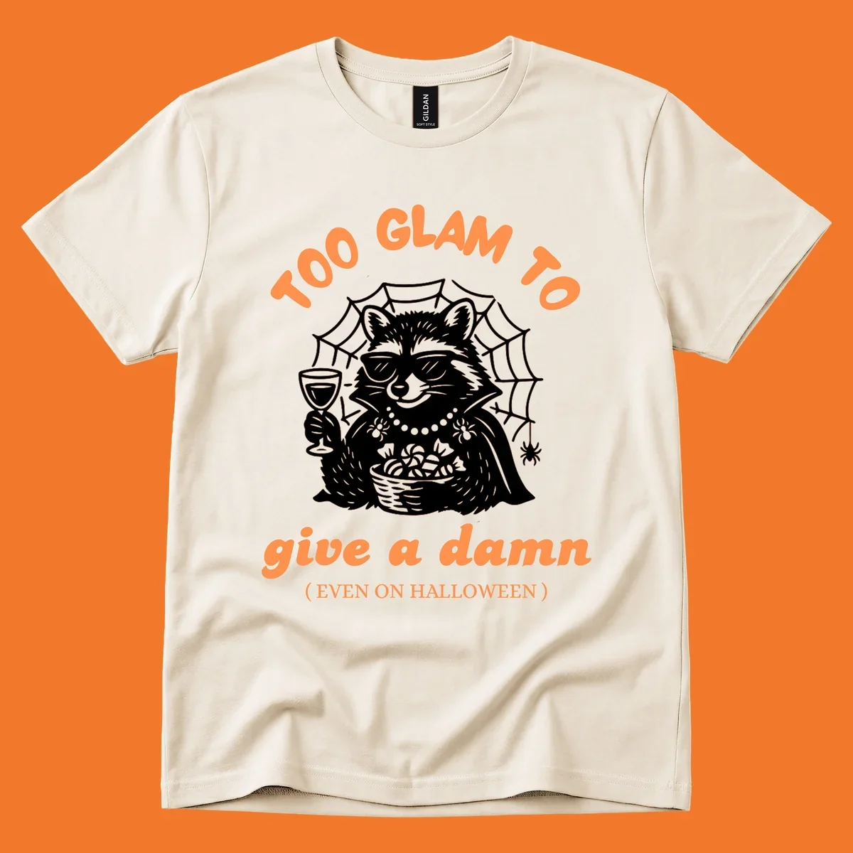Glam raccoon with sunglasses and wine, 'Too Glam To Give A Damn' text for Halloween.