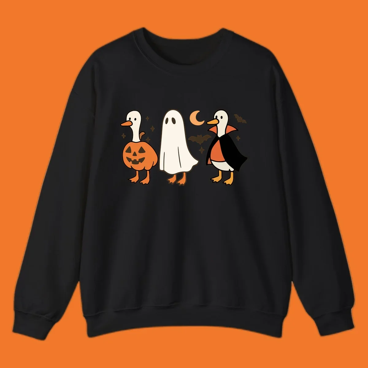 Halloween duck costumes: pumpkin, ghost, and vampire, with moon and bats. Halloween-duck-costumes.