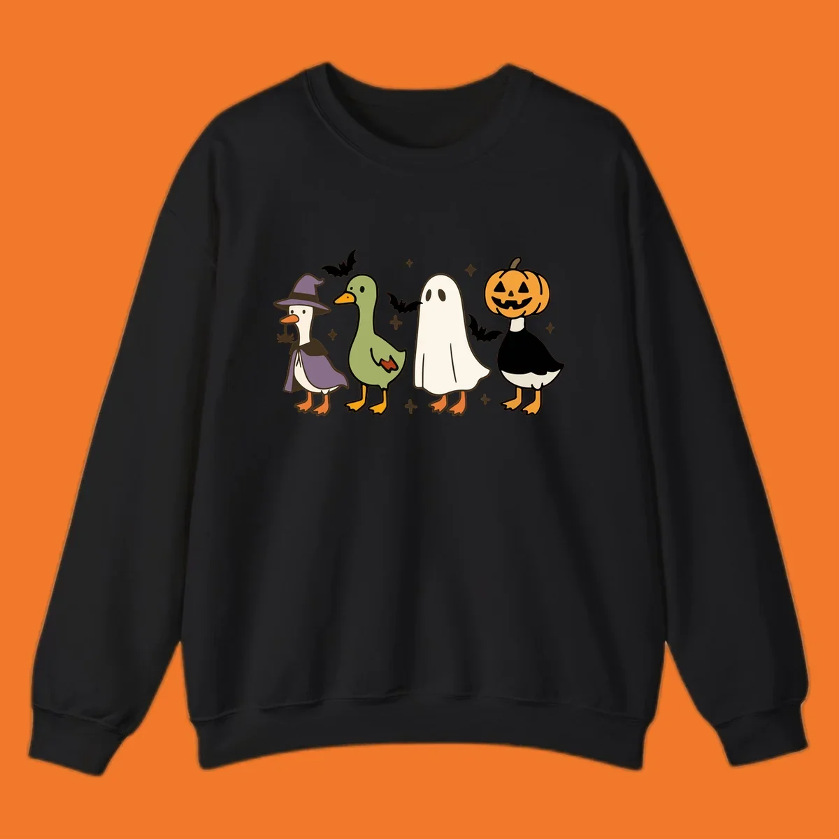 Illustration of four cute animals in Halloween costumes: a witch goose, a duckling, a ghost, and a pumpkin goose.
