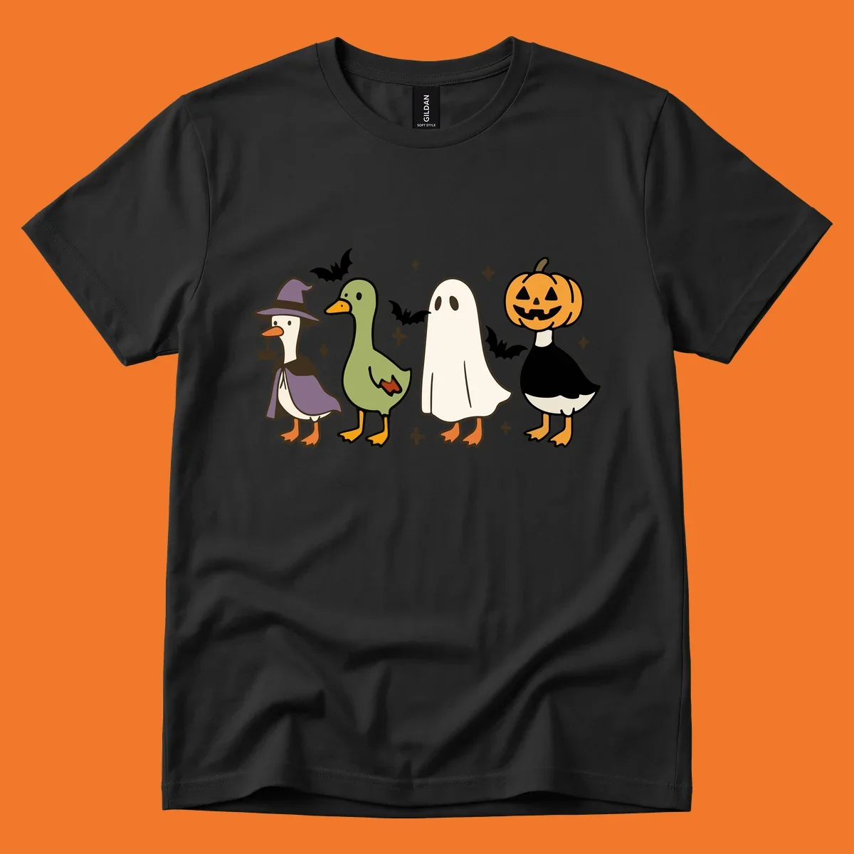 Illustration of four cute animals in Halloween costumes: a witch goose, a duckling, a ghost, and a pumpkin goose.