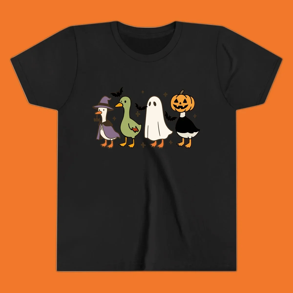 Illustration of four cute animals in Halloween costumes: a witch goose, a duckling, a ghost, and a pumpkin goose.