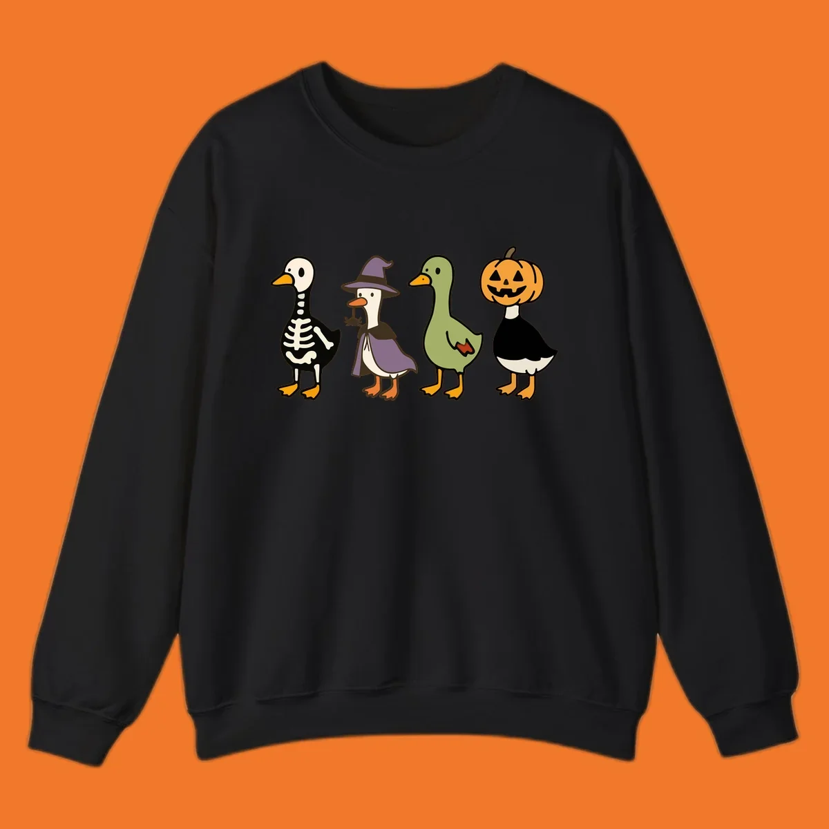 Four ducks in Halloween costumes: skeleton, witch, plain, and jack-o-lantern. Funny Halloween duck costumes.