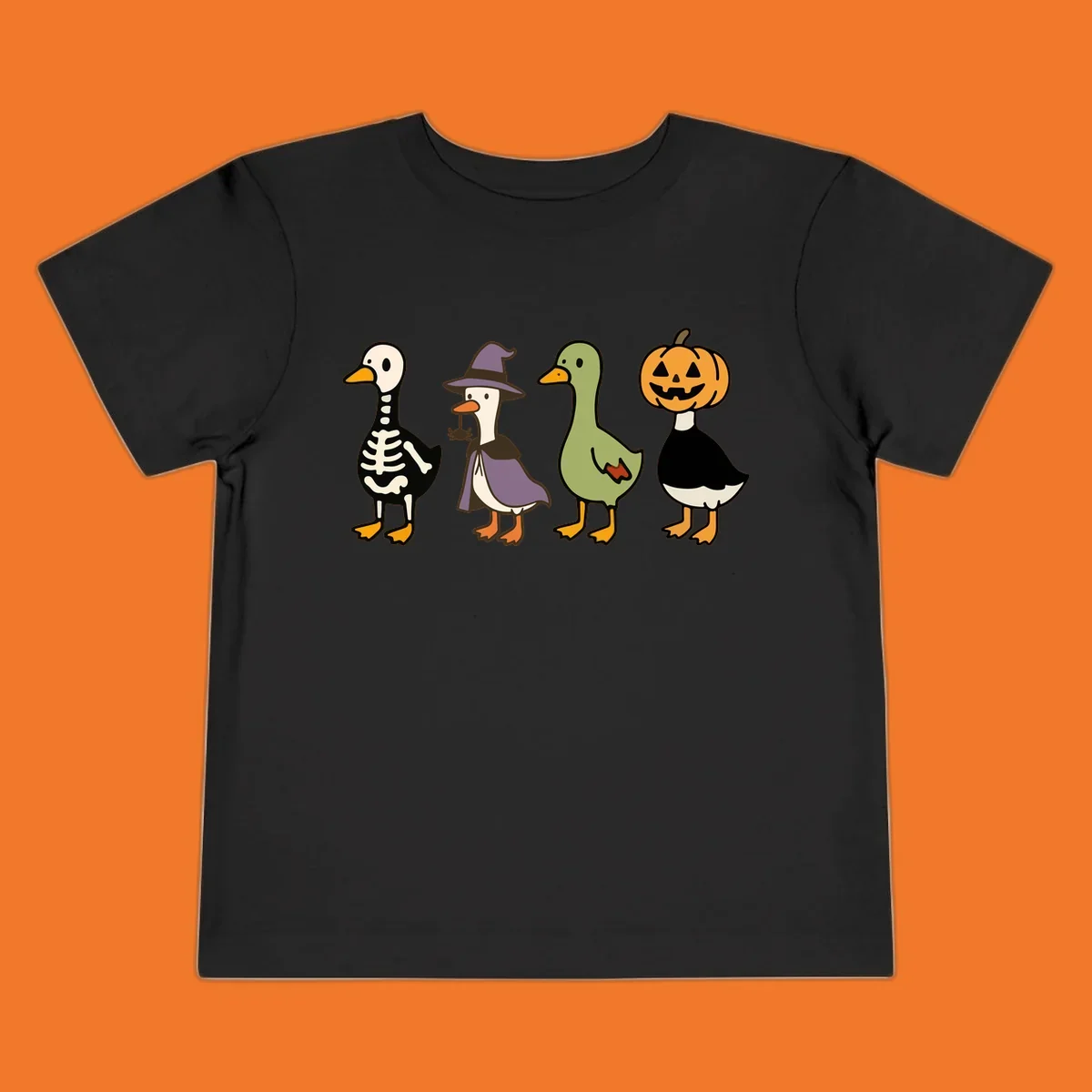 Four ducks in Halloween costumes: skeleton, witch, plain, and jack-o-lantern. Funny Halloween duck costumes.