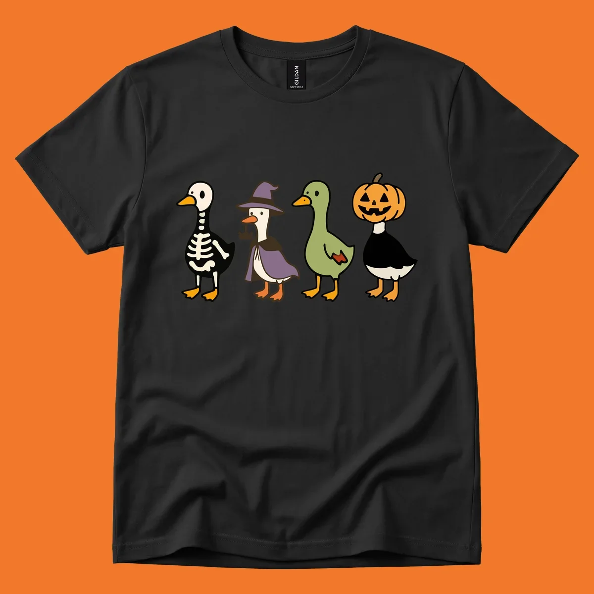 Four ducks in Halloween costumes: skeleton, witch, plain, and jack-o-lantern. Funny Halloween duck costumes.