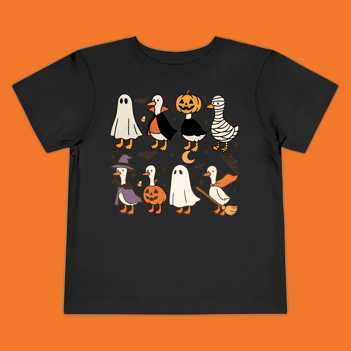 Illustration of cute ducks in various Halloween costumes like ghost, vampire, and pumpkin, on a dark background.