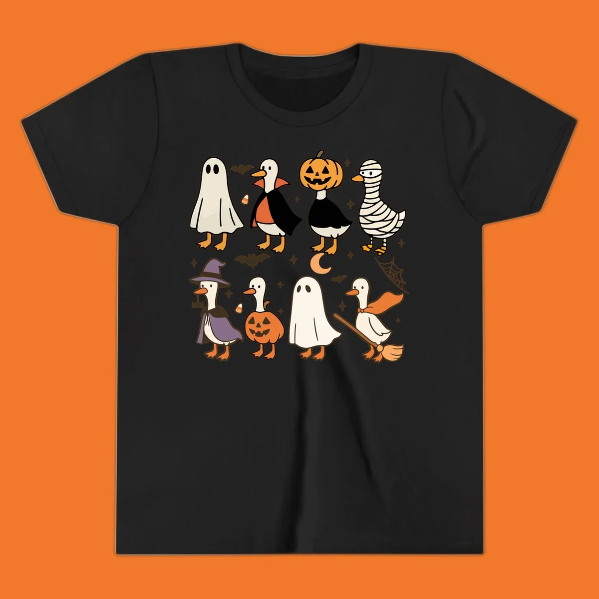 Illustration of cute ducks in various Halloween costumes like ghost, vampire, and pumpkin, on a dark background.