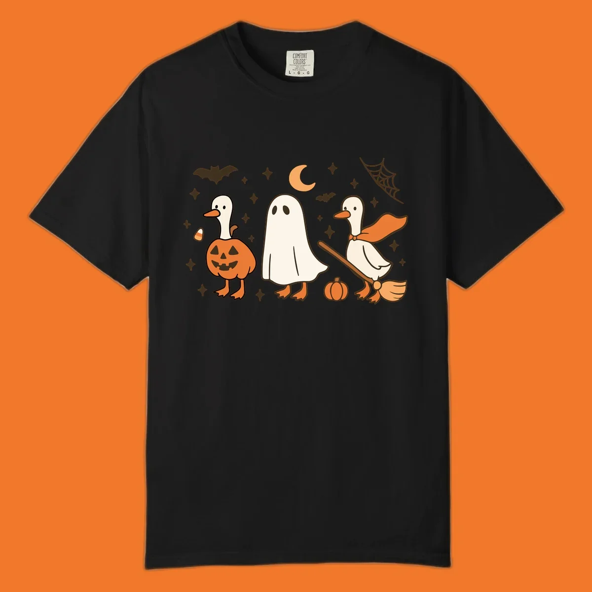 Cute geese in Halloween costumes: pumpkin, ghost, and witch on broom, with bats and stars.