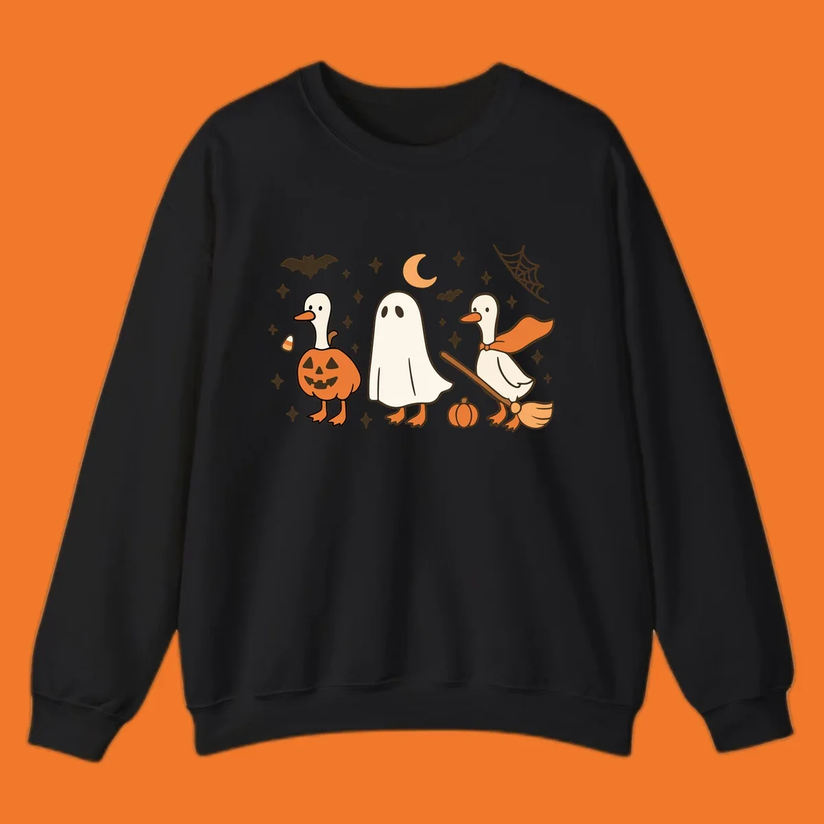 Cute geese in Halloween costumes: pumpkin, ghost, and witch on broom, with bats and stars.