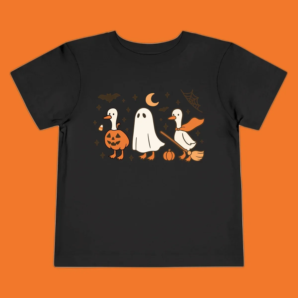 Cute geese in Halloween costumes: pumpkin, ghost, and witch on broom, with bats and stars.