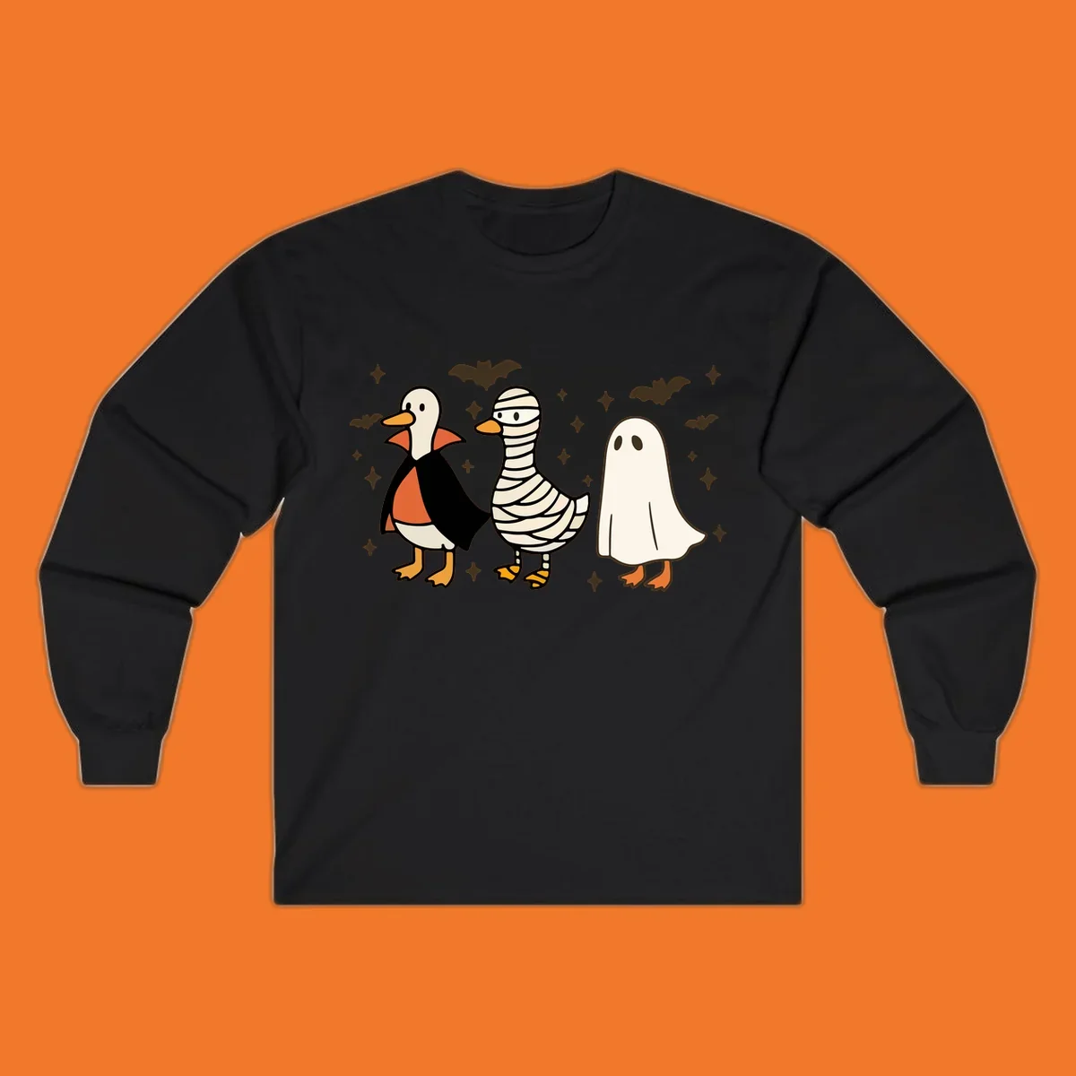 Halloween duck trio in costumes: vampire, mummy, and ghost. holiday-duck-trio.