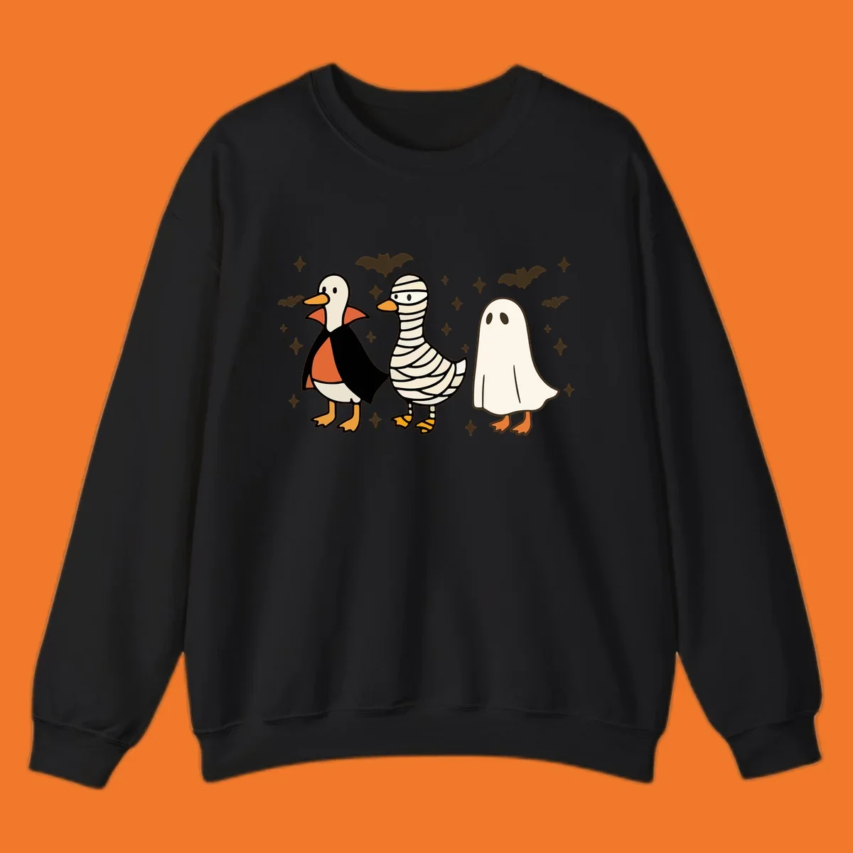 Halloween duck trio in costumes: vampire, mummy, and ghost. holiday-duck-trio.
