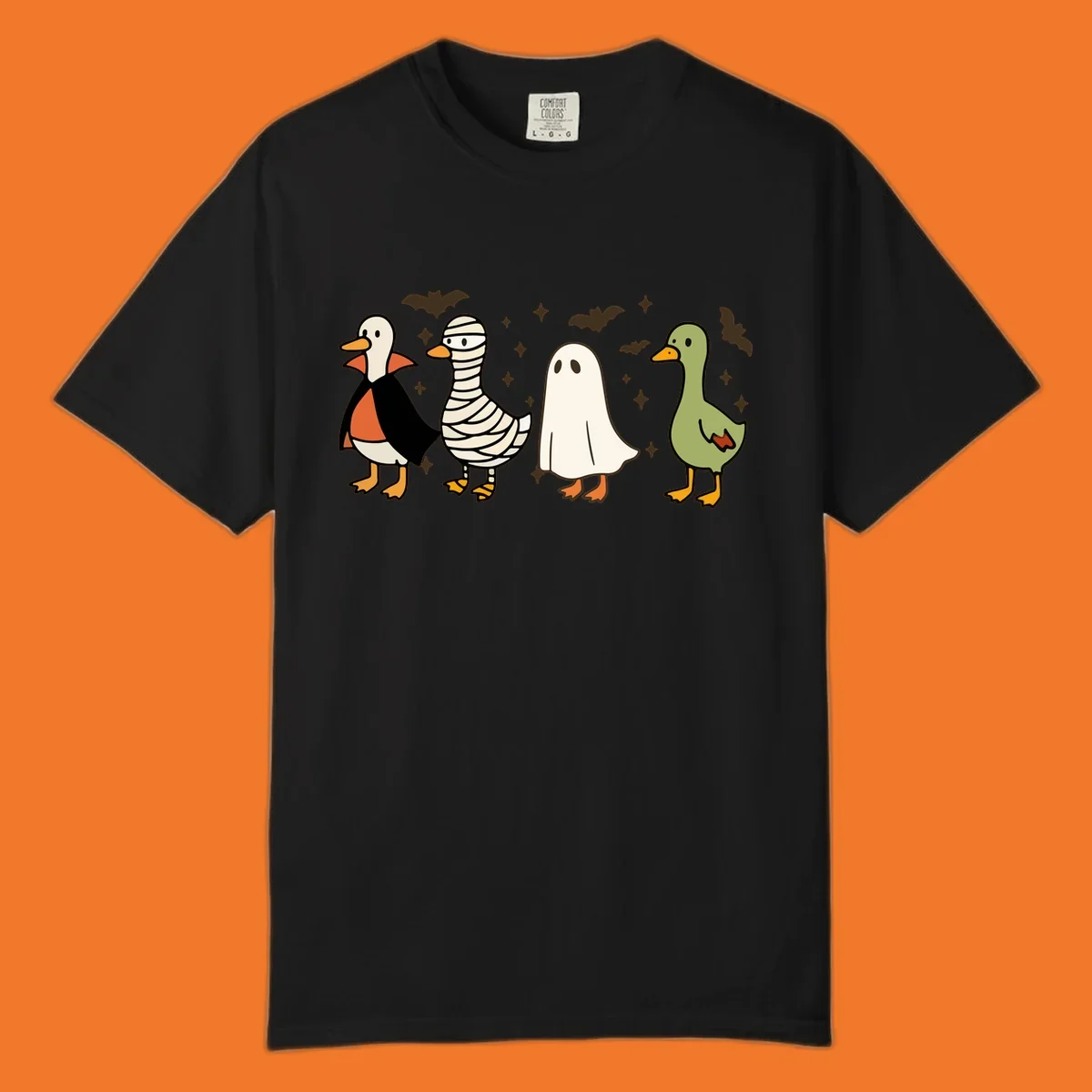 Four cute ducks in Halloween costumes: vampire, mummy, ghost, and plain duck, with bats and stars.