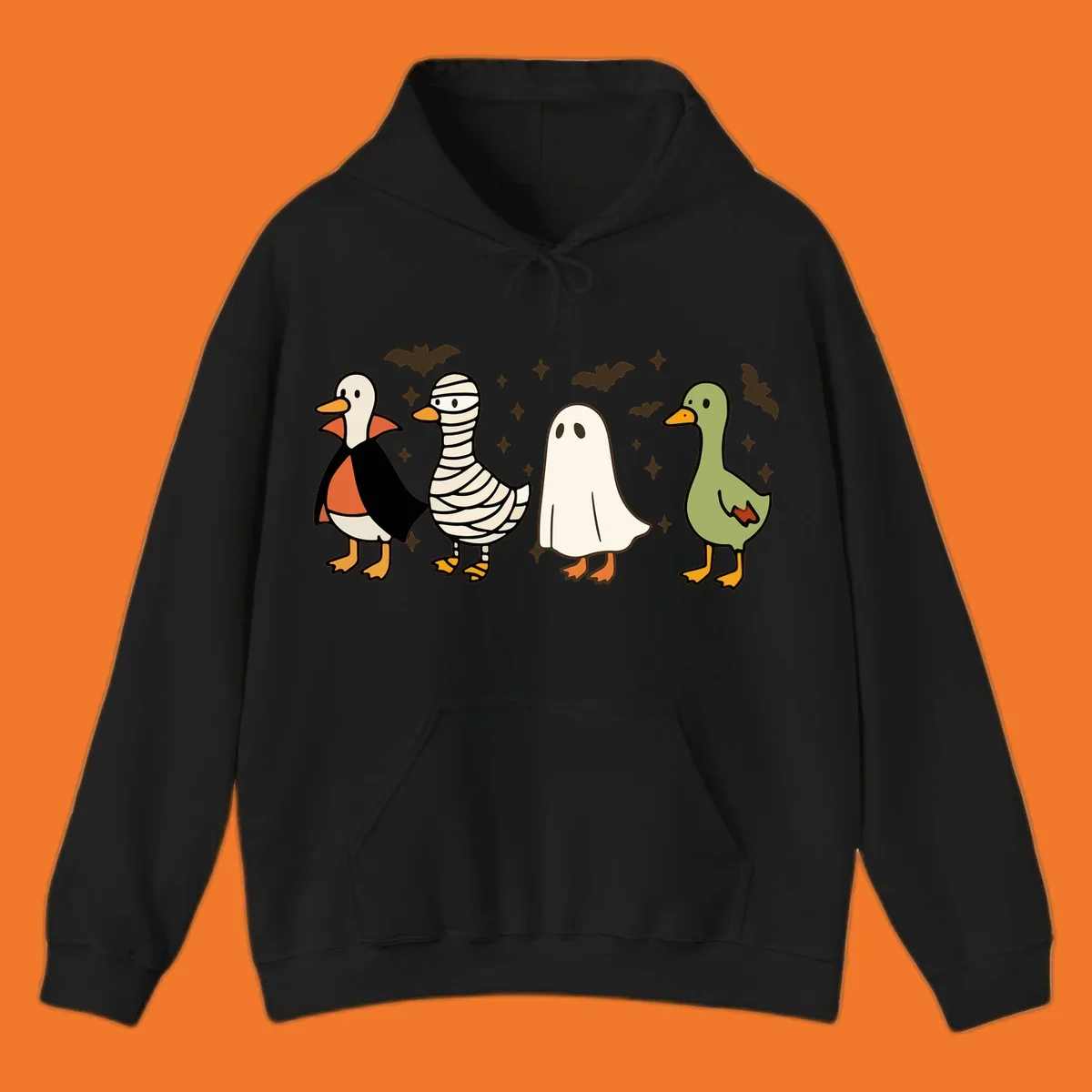 Four cute ducks in Halloween costumes: vampire, mummy, ghost, and plain duck, with bats and stars.