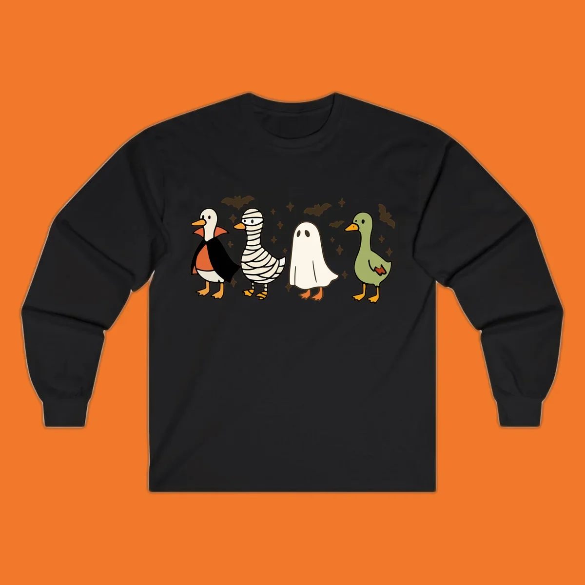 Four cute ducks in Halloween costumes: vampire, mummy, ghost, and plain duck, with bats and stars.
