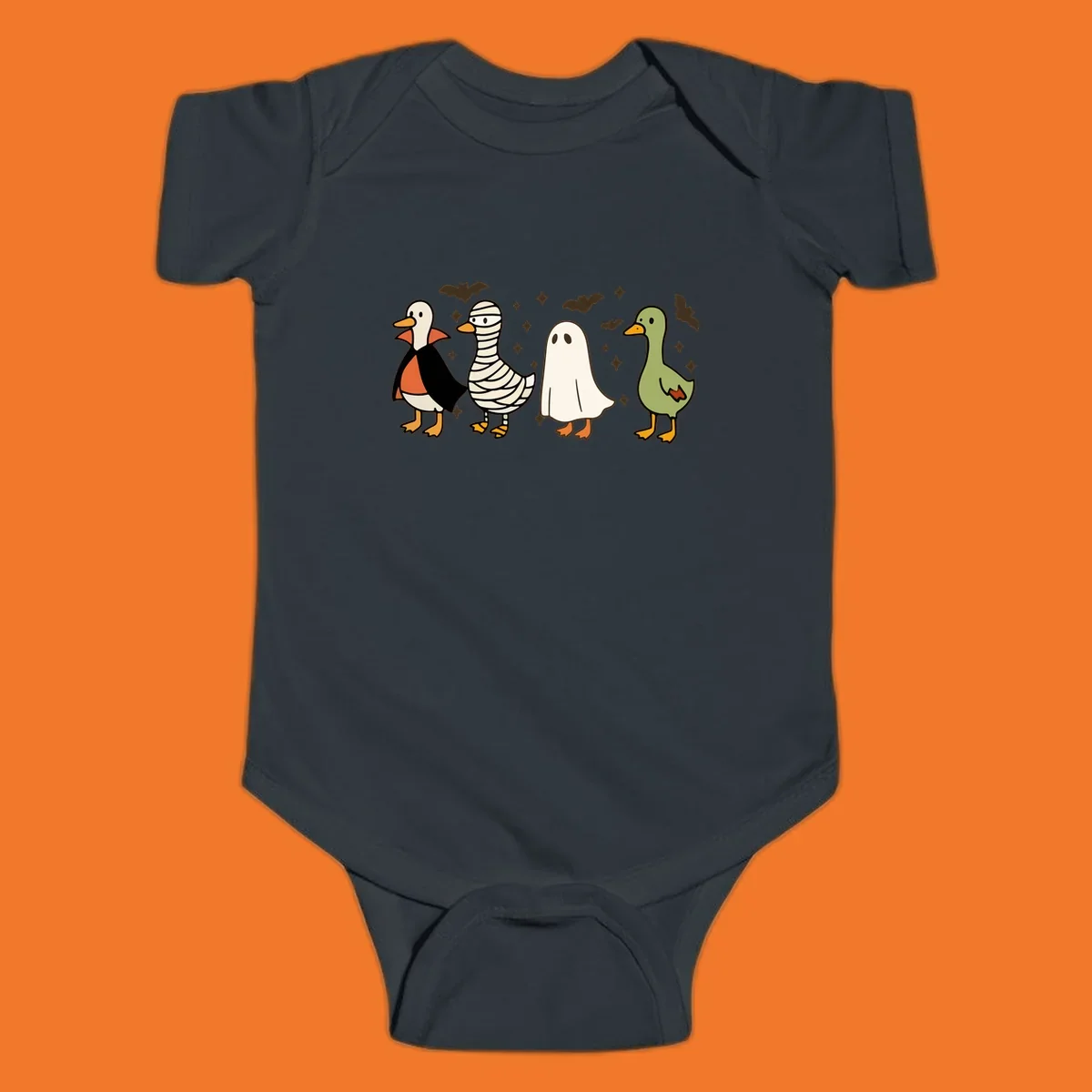 Four cute ducks in Halloween costumes: vampire, mummy, ghost, and plain duck, with bats and stars.