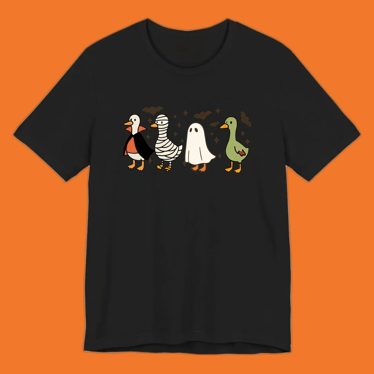 Four cute ducks in Halloween costumes: vampire, mummy, ghost, and plain duck, with bats and stars.