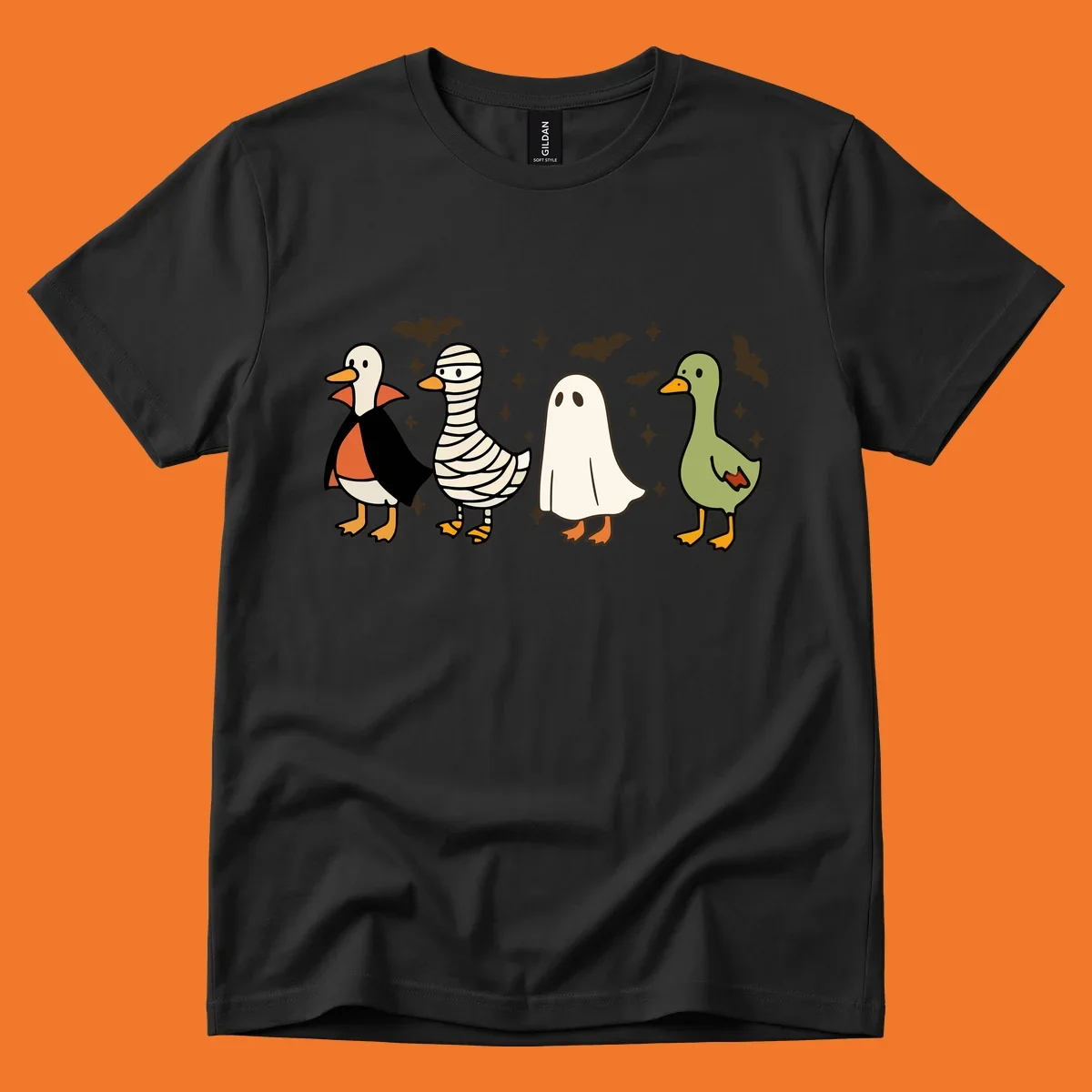 Four cute ducks in Halloween costumes: vampire, mummy, ghost, and plain duck, with bats and stars.