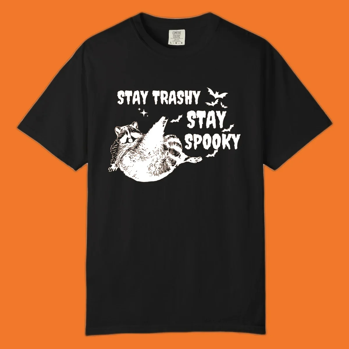 Trashy spooky raccoon illustration with bats and text for Halloween.