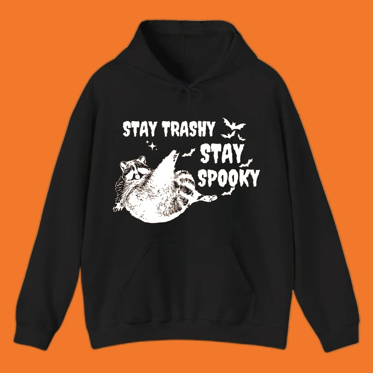 Trashy spooky raccoon illustration with bats and text for Halloween.