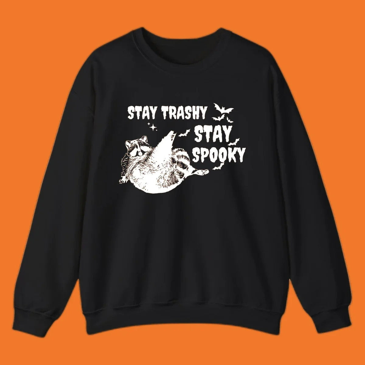 Trashy spooky raccoon illustration with bats and text for Halloween.