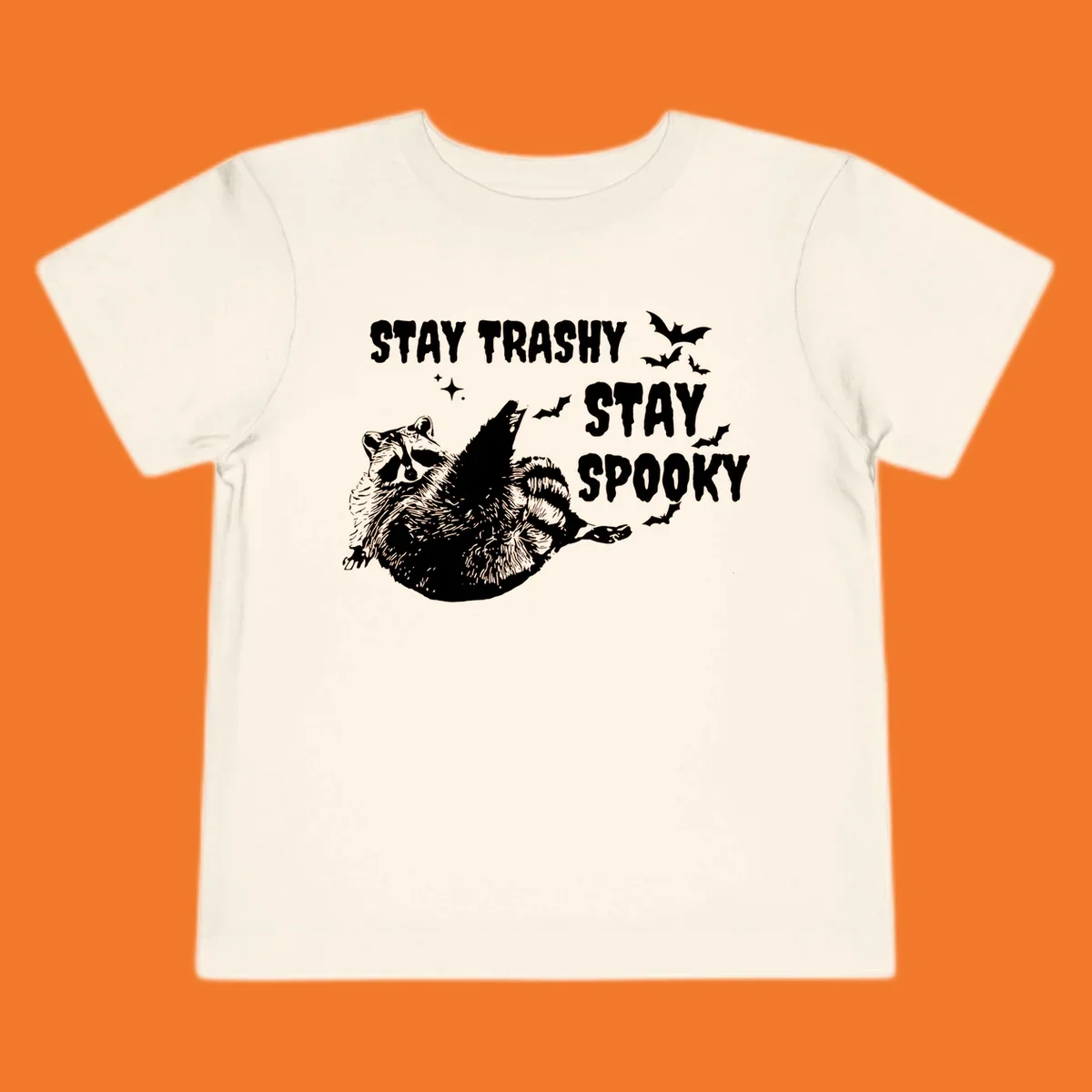 Trashy spooky raccoon illustration with bats and text for Halloween.