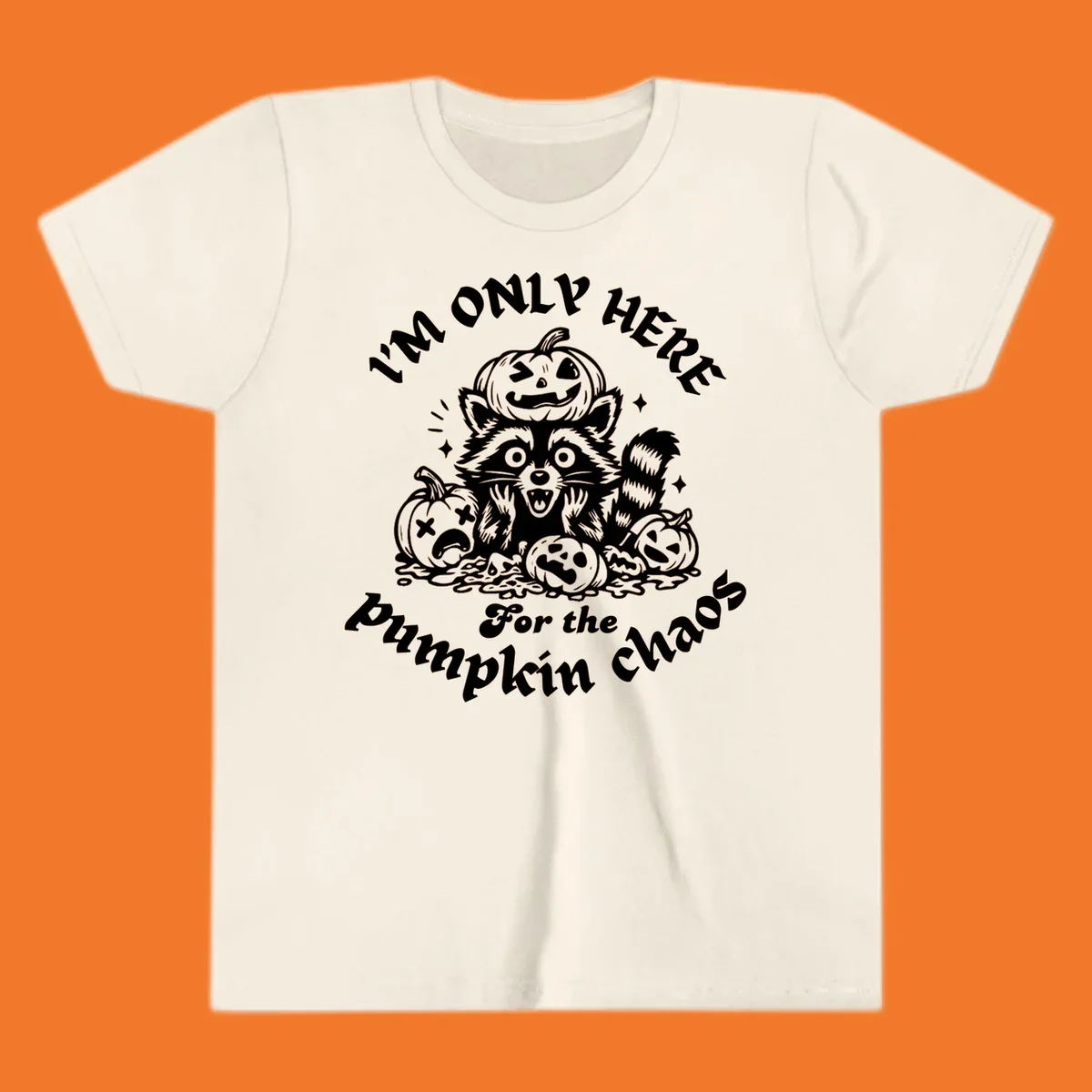Illustration of a raccoon surrounded by pumpkins, text says 'I'm Only Here For The Pumpkin Chaos'.