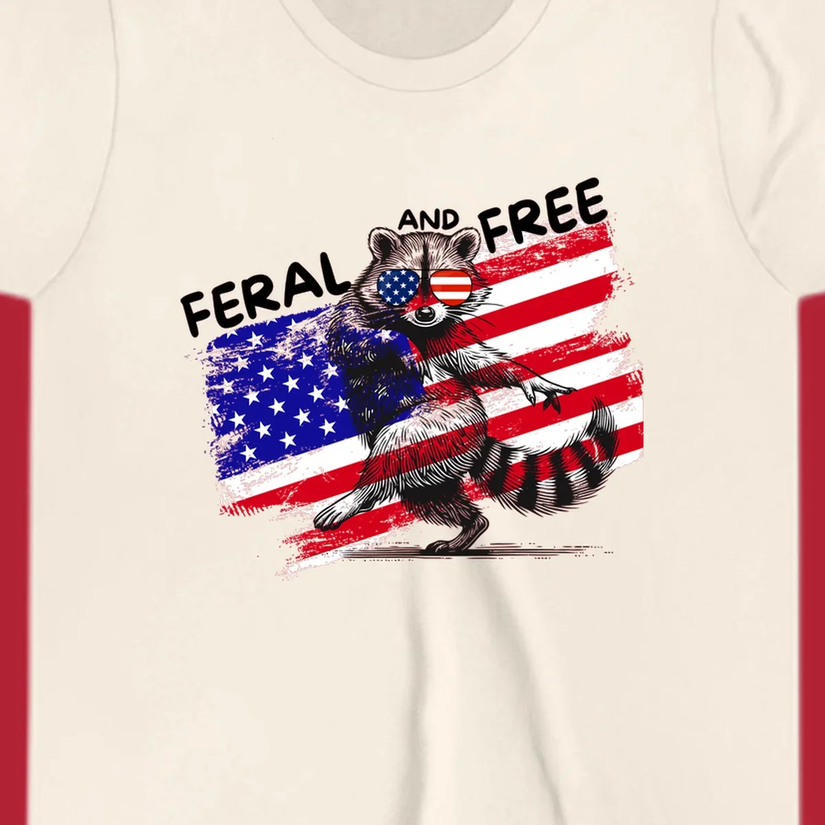 A standing raccoon with an American flag design and USA flag sunglasses, with the text 'FERAL AND FREE'. feral-free-raccoon-flag.