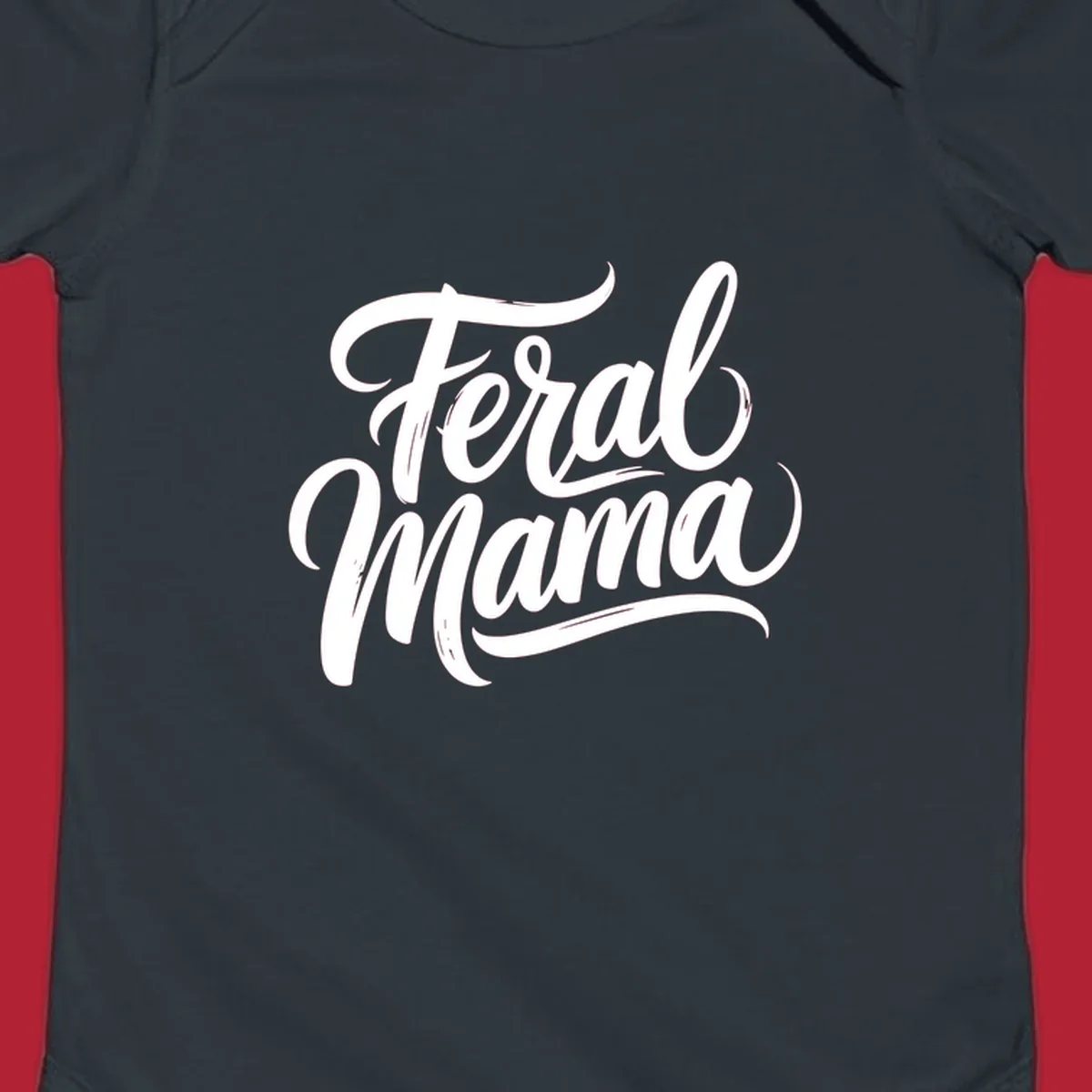 Bold black script text reading 'Feral Mama' with decorative flourishes, highlighting the feral mama script concept.