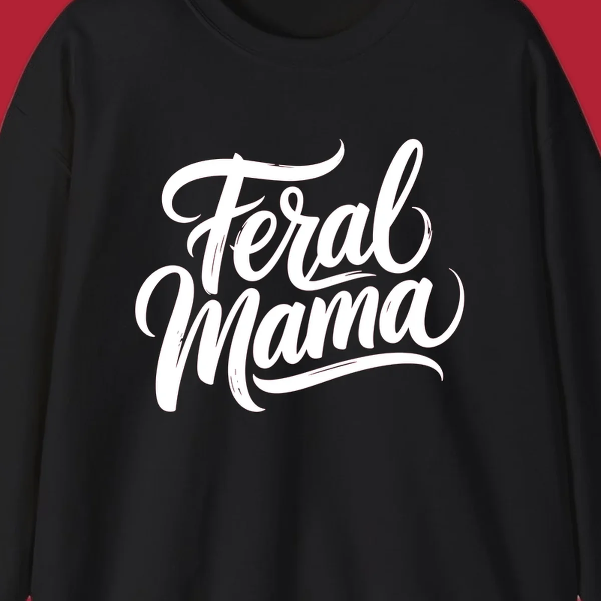 Bold black script text reading 'Feral Mama' with decorative flourishes, highlighting the feral mama script concept.