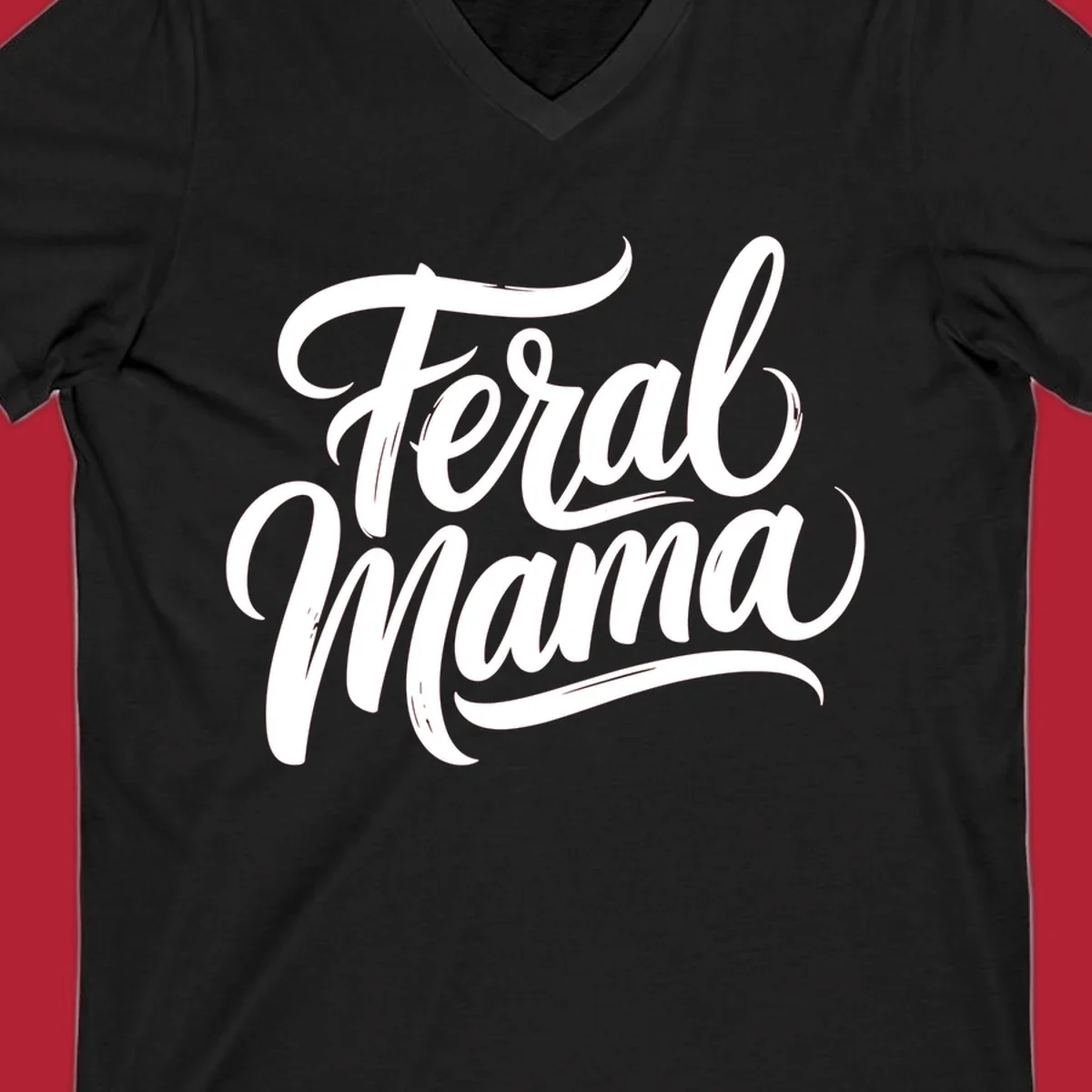Bold black script text reading 'Feral Mama' with decorative flourishes, highlighting the feral mama script concept.