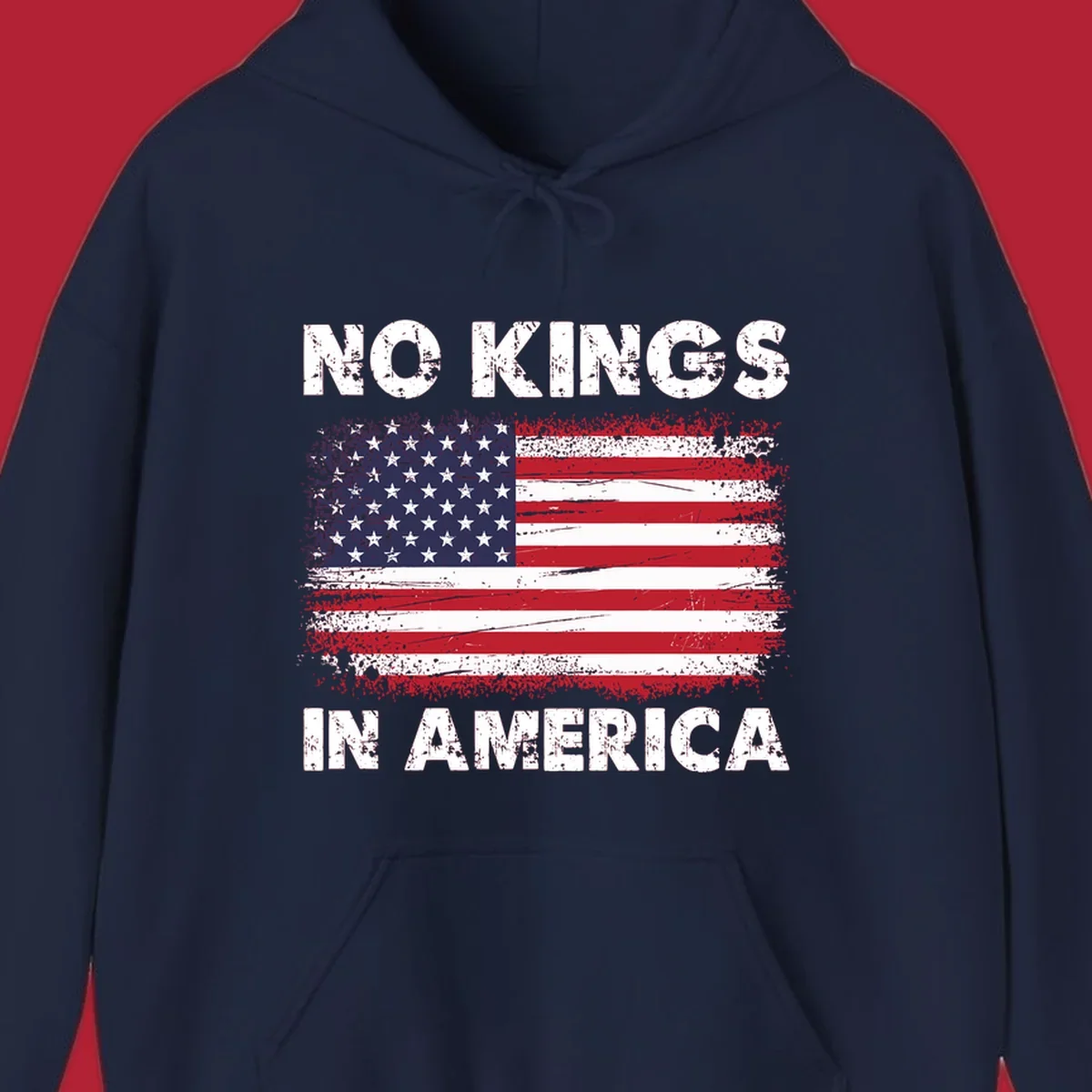 A distressed American flag with the white text 'NO KINGS IN AMERICA' above and below it.
