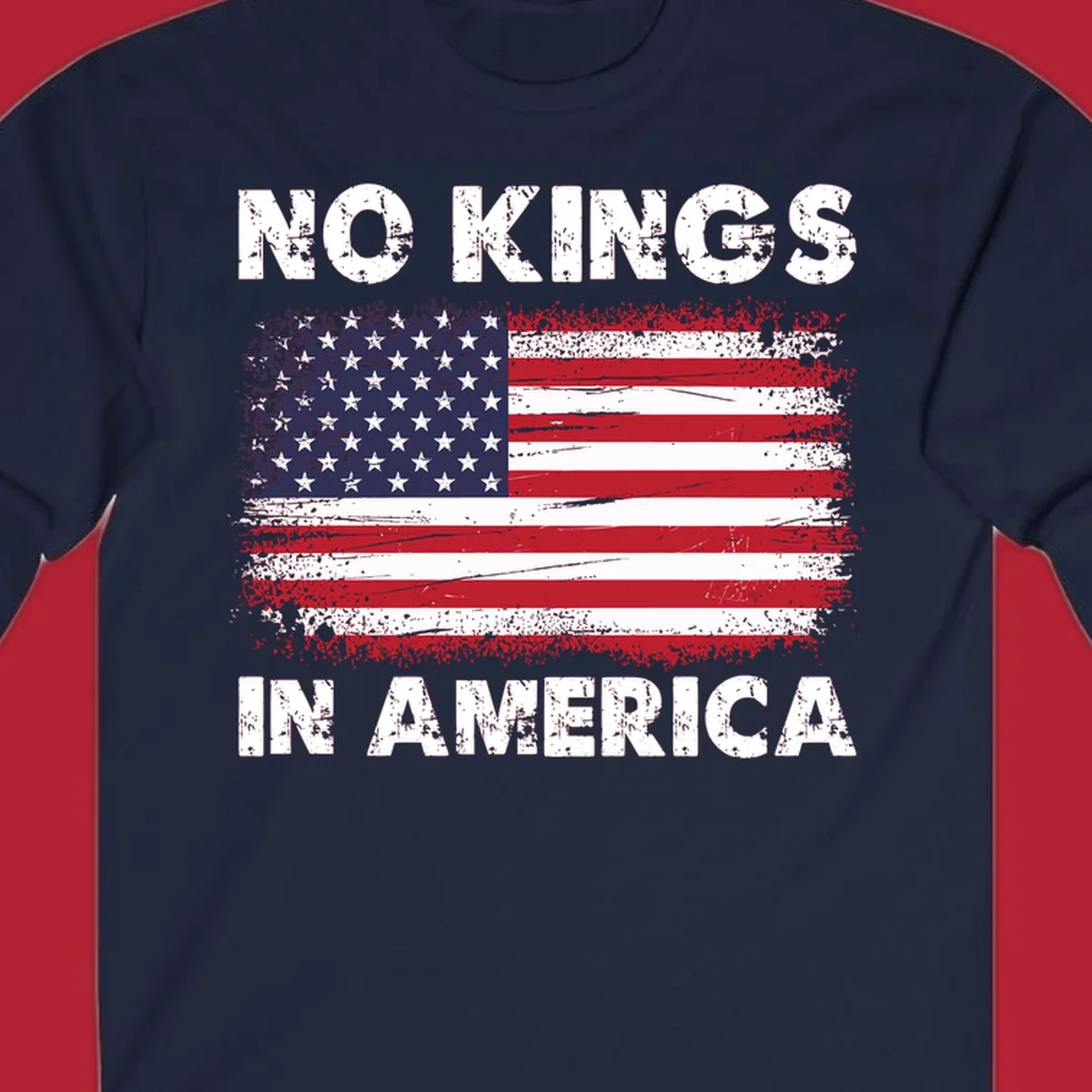 A distressed American flag with the white text 'NO KINGS IN AMERICA' above and below it.