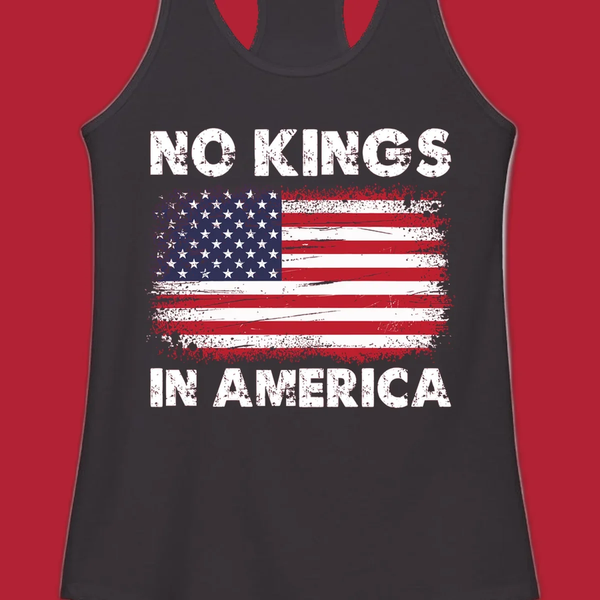 A distressed American flag with the white text 'NO KINGS IN AMERICA' above and below it.
