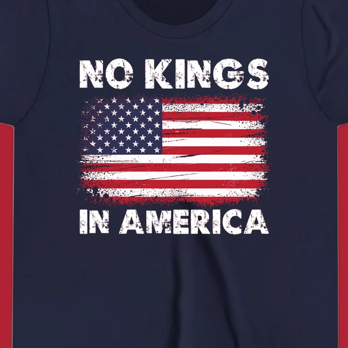 A distressed American flag with the white text 'NO KINGS IN AMERICA' above and below it.