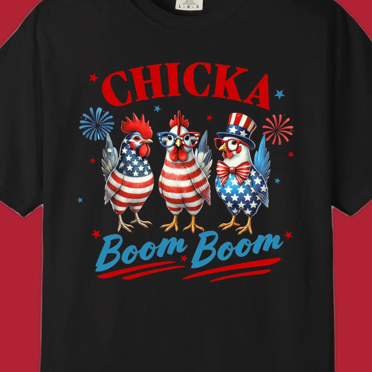 Three patriotic chickens in American flag patterns with fireworks and stars, text reads 'Chicka Boom Boom'. Features the chicka-boom-boom-patriotic-chickens concept.