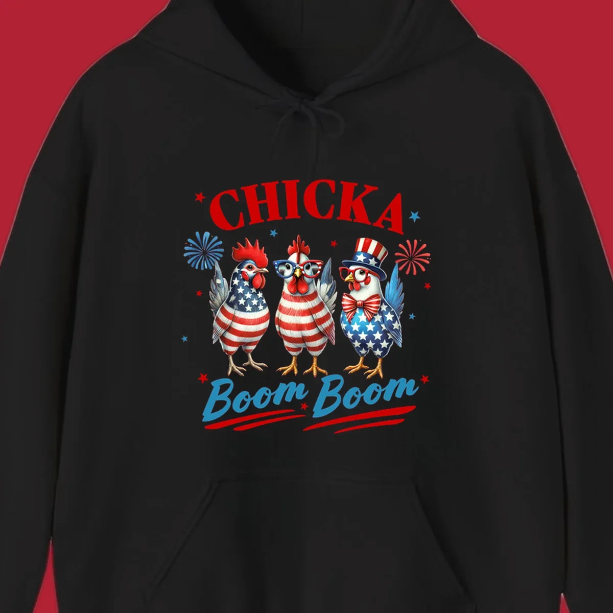 Three patriotic chickens in American flag patterns with fireworks and stars, text reads 'Chicka Boom Boom'. Features the chicka-boom-boom-patriotic-chickens concept.