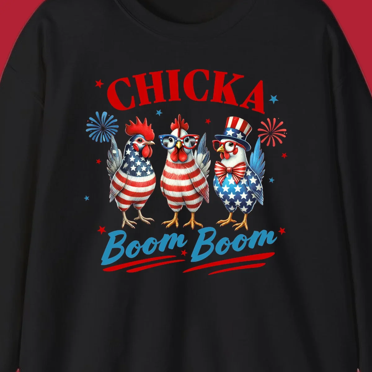 Three patriotic chickens in American flag patterns with fireworks and stars, text reads 'Chicka Boom Boom'. Features the chicka-boom-boom-patriotic-chickens concept.