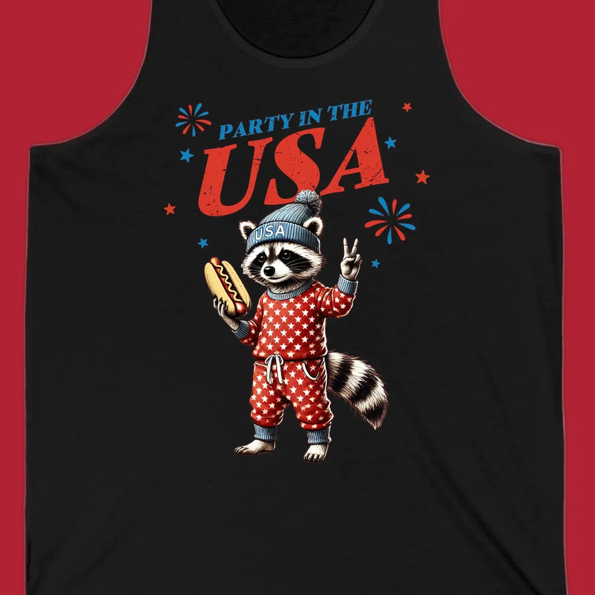 A cartoon raccoon wearing a USA beanie and star-patterned pajamas, holding a hotdog and making a peace sign, with 'PARTY IN THE USA' text and fireworks.