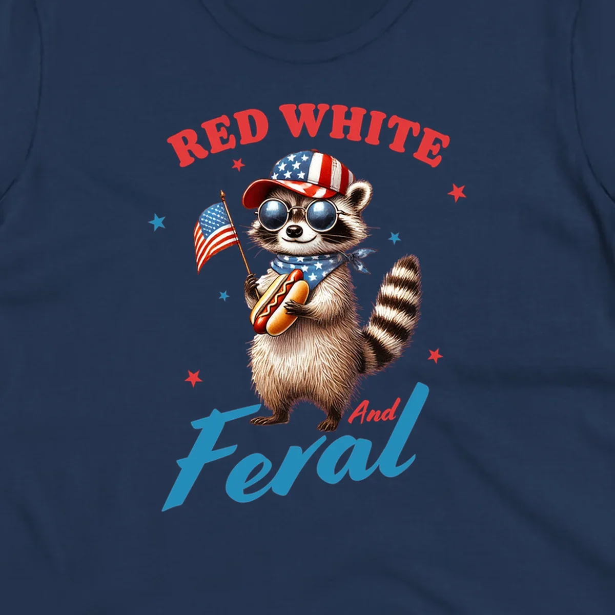 A cartoon raccoon wearing a patriotic hat and bandana, holding an American flag and a hot dog, with 'Red White And Feral' text. This is a red-white-feral-raccoon design.