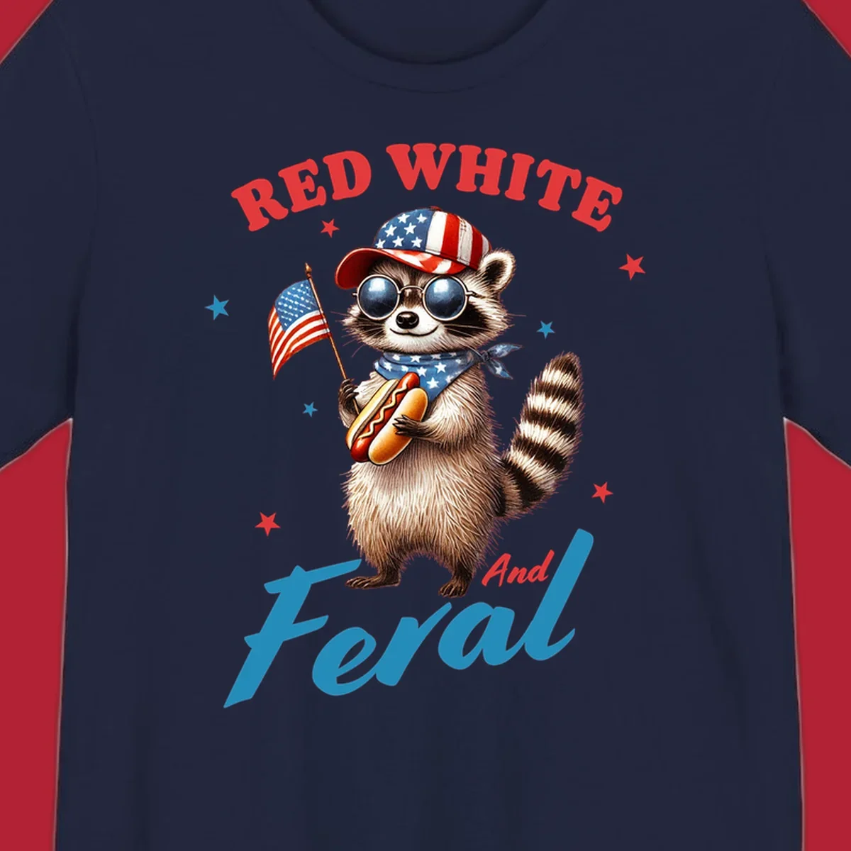 A cartoon raccoon wearing a patriotic hat and bandana, holding an American flag and a hot dog, with 'Red White And Feral' text. This is a red-white-feral-raccoon design.