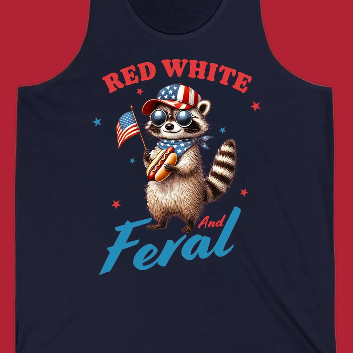 A cartoon raccoon wearing a patriotic hat and bandana, holding an American flag and a hot dog, with 'Red White And Feral' text. This is a red-white-feral-raccoon design.