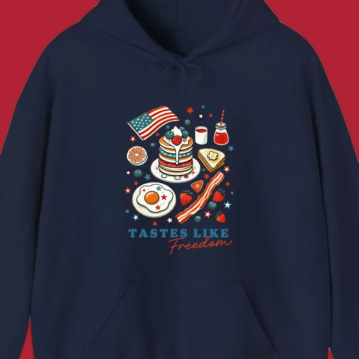 An illustration of a patriotic breakfast with an American flag, pancakes, bacon, eggs, and the text 'Tastes Like Freedom'.