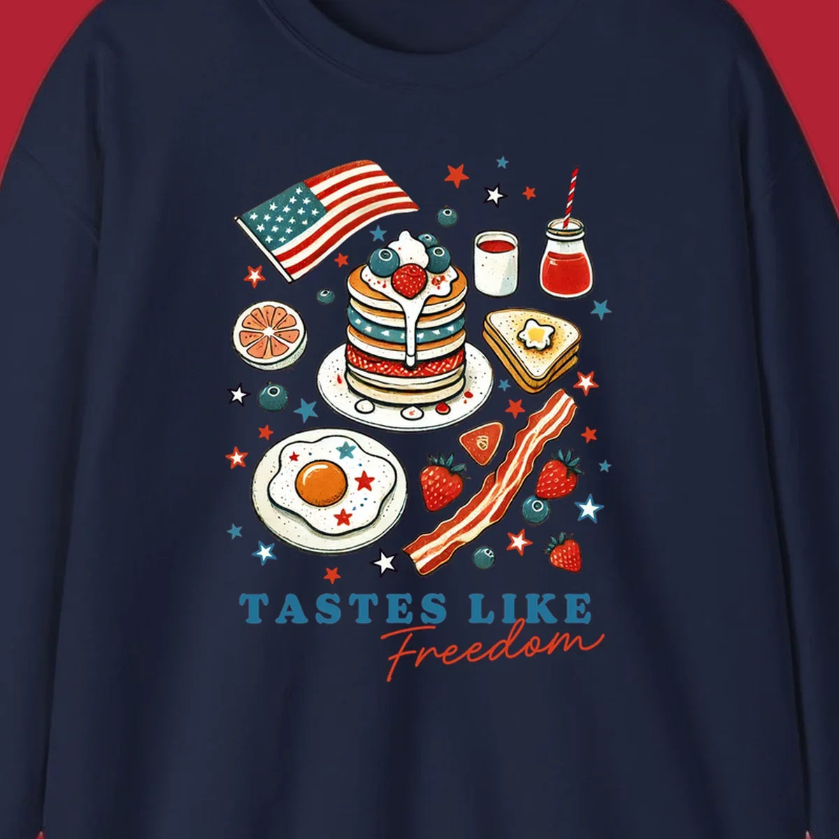 An illustration of a patriotic breakfast with an American flag, pancakes, bacon, eggs, and the text 'Tastes Like Freedom'.