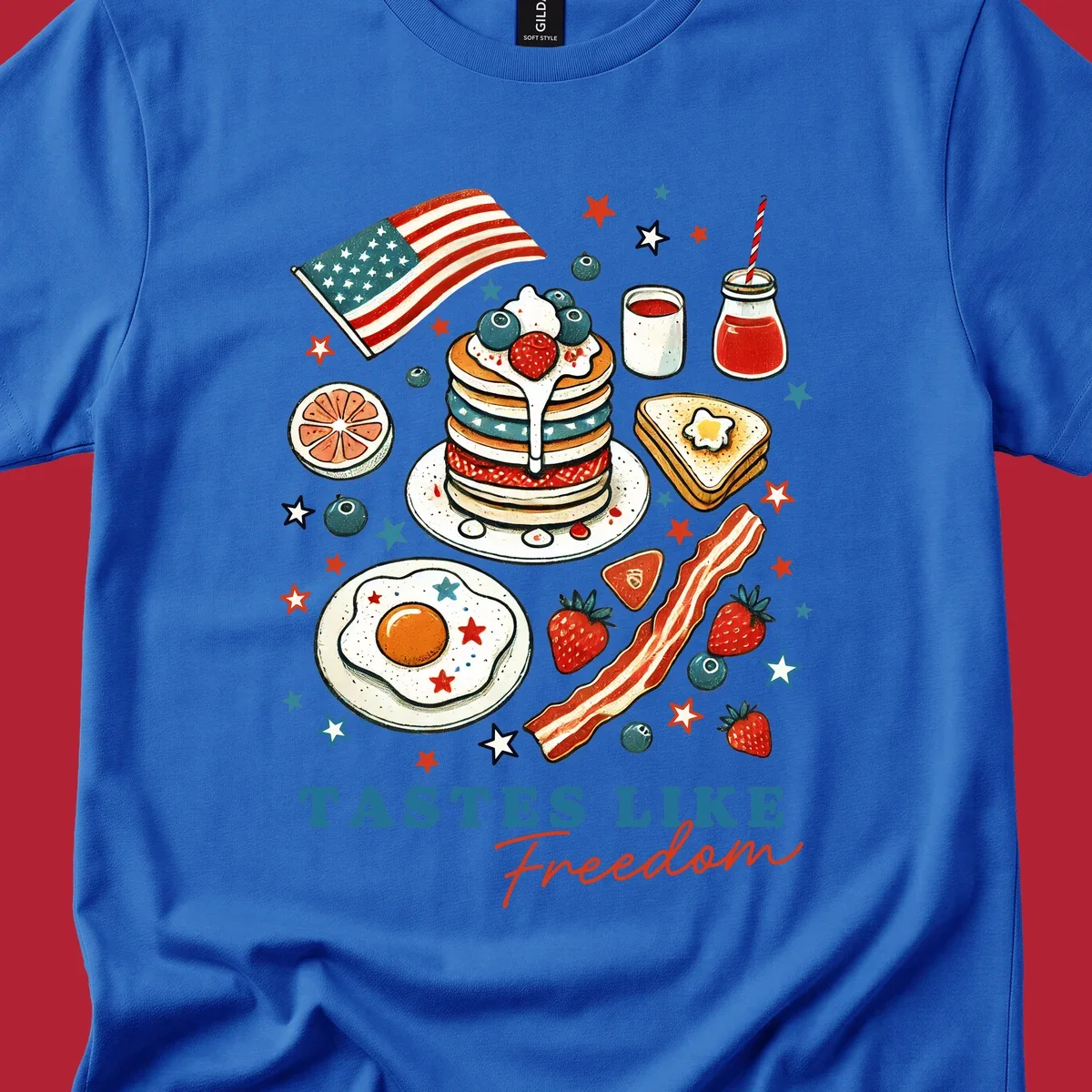 An illustration of a patriotic breakfast with an American flag, pancakes, bacon, eggs, and the text 'Tastes Like Freedom'.